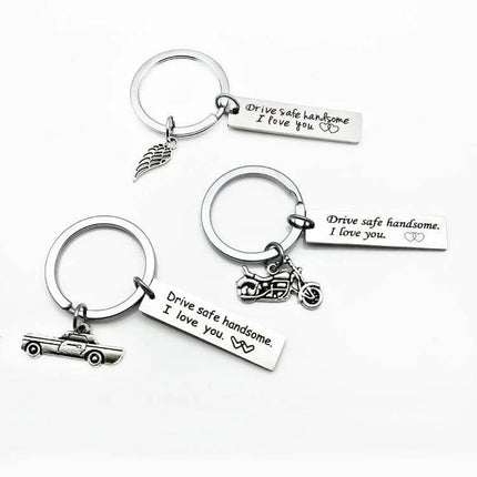 Stainless Steel Keychain Wing Shape For Everyday Use - durable wing silhouette keyring with engraved ‘Drive safe handsome, I love you’ tag