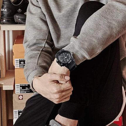 SKMEI Men's Waterproof Outdoor Sports Watch with Large Dial shown on a man's wrist in casual outfit, large 55mm dial and rugged strap