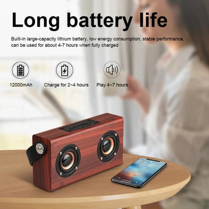Daily Companion Wooden Bluetooth Speaker For Home And Travel on table with smartphone showcasing long battery life features