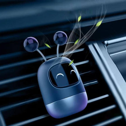 Cartoon Robot Car Air Outlet Aromatherapy Diffuser With Soft Clip attached to car vent releasing light fragrance