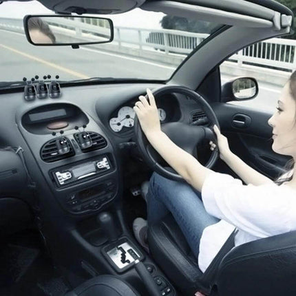 Cartoon Robot Car Aromatherapy Paste for Car Interiors placed on dashboard deodorizing car cabin