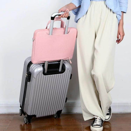 Practical Everyday Shoulder Bag for 13.3 to 15.6 Inch Laptops shown attached to trolley case, pink waterproof Oxford cloth laptop bag for travel