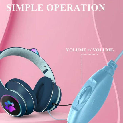 Foldable Cat Ear Headset With Rotating Mic For Calls in navy with paw LED, foldable design, inline volume control on pink background