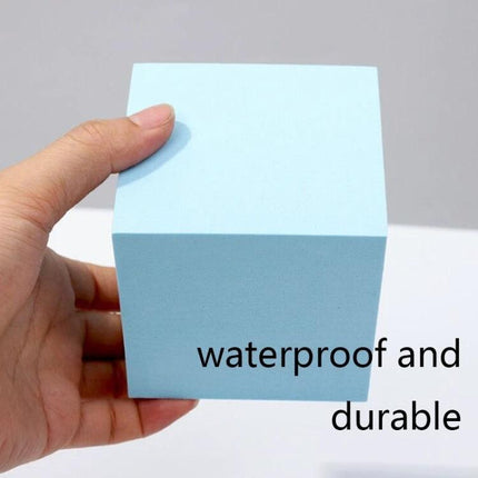 Solid Color Geometric Shapes Polymer Foam Props for Photography showing a hand holding a light blue waterproof foam cube for product staging