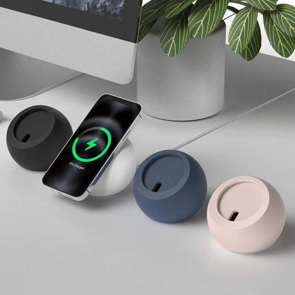 Silicone Pellet MagSafe Charger Holder for iPhone 12 Series shown in black, gray, blue and pink stabilizing MagSafe charger on desk