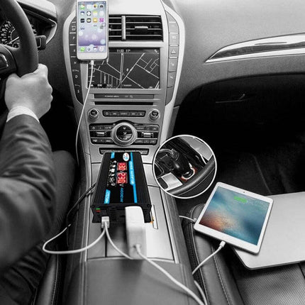 Car Power Inverter for Charging Devices on the Go plugged into car 12V outlet powering phone tablet and laptop on road trips