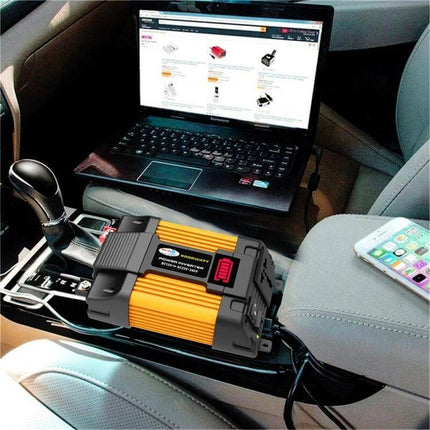 Little Wasp Car Inverter for Charging Devices in Vehicles powering laptop and phone inside a car on a road trip