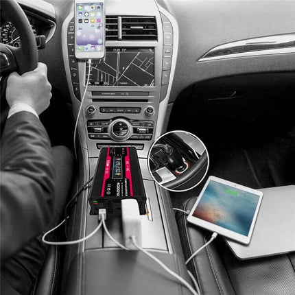 Zhizun Car Power Inverter for Running Devices in Vehicles powering laptop, tablet and phone in a car center console on a road trip
