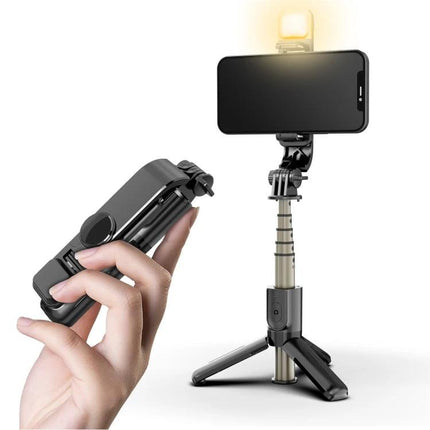 Essential Selfie Stick for Everyday Photos and Calls holding phone with light, folded for travel and extended as tripod for selfies and video calls