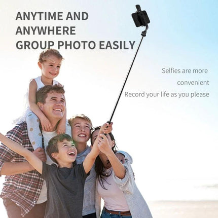 Versatile Tripod for Capturing Everyday Phone Moments being used as a selfie stick for a family group photo on the beach