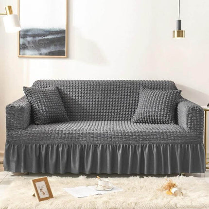Stretch Sofa Cover With Skirt for Double M 145-185cm Sofas in gray seersucker fabric with lotus-leaf skirt, straps and fitted protective design