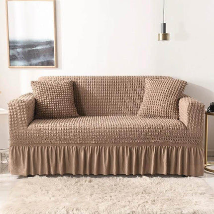Stretch Sofa Cover With Skirt for Double M 145-185cm Sofas in beige seersucker fabric with lotus-leaf bottom skirt and anti-slip straps protecting sofa