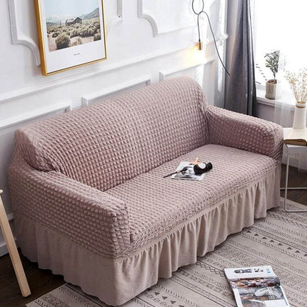 Stretch Sofa Cover With Skirt for Double M 145-185cm Sofas in beige seersucker fabric with lotus-leaf bottom skirt and straps protecting sofa from spills and pet hair