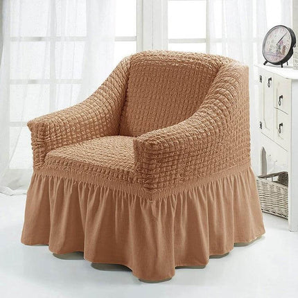Four Seasons Universal Elastic Skirt Style Sofa Cover 90-140cm in beige on armchair, polyester elastic edges protect from pets and kids