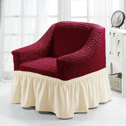 Four Seasons Universal Elastic Skirt Style Sofa Cover 90-140cm shown on a red armchair with cream skirt protecting upholstery and preventing sagging