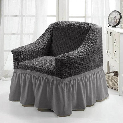 Four Seasons Universal Elastic Skirt Style Sofa Cover 90-140cm on grey armchair protecting upholstery with pleated skirt