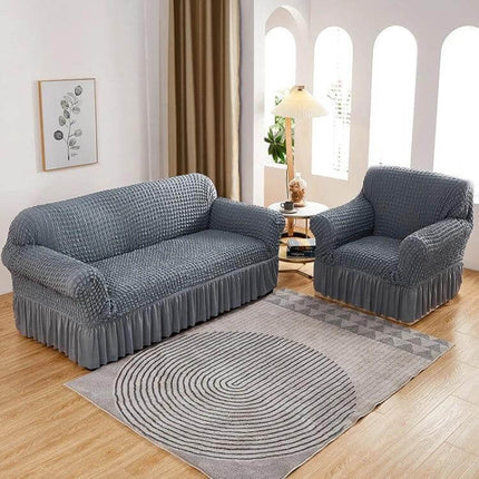 Four Seasons Universal Elastic Skirt Style Sofa Cover 90-140cm on gray sofa and armchair, textured polyester skirt-style full-coverage slipcover protecting furniture