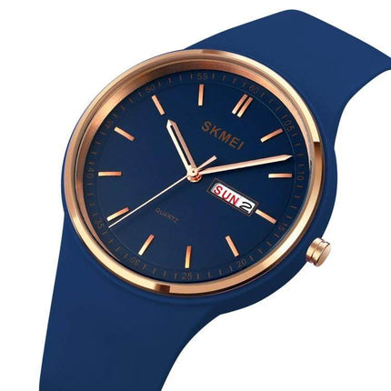 SKMEI Ladies Quartz Watch with Silicone Strap and Daily Functions — navy silicone strap, rose gold bezel, day-date display, lightweight everyday women’s watch