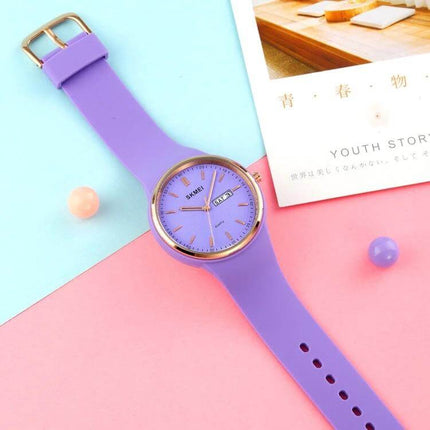 SKMEI Ladies Quartz Watch with Silicone Strap and Daily Functions purple silicone strap ladies watch shown flat on pastel background