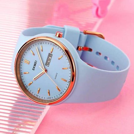 SKMEI Ladies Quartz Watch with Silicone Strap and Daily Functions - pastel blue silicone strap, rose gold bezel, day/date display