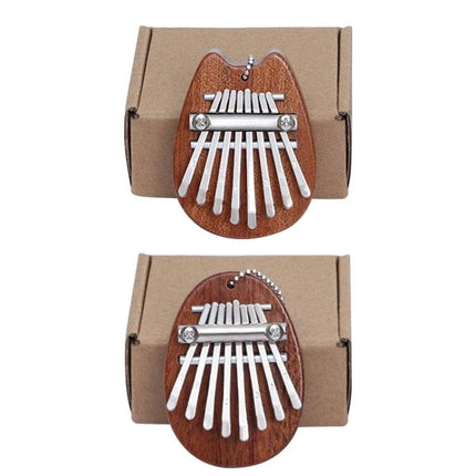 Thumb Piano Kalimba for Relaxing Moments in Daily Life - compact wooden thumb piano on kraft box, portable calming instrument for home or commute