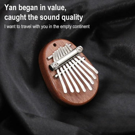 Thumb Piano Kalimba for Relaxing Moments in Daily Life - compact wooden kalimba on black cloth for soothing thumb-played melodies