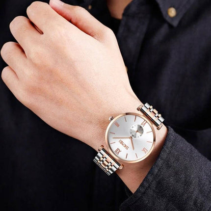 SKMEI Stylish Roman Numeral Watch for Couples Daily Wear - rose gold and silver men's watch on wrist with Roman numeral dial