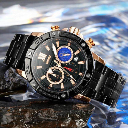 Alt Tag: SKMEI Men's Stainless Steel Watch with Moonphase Feature showing black stainless bracelet, moonphase subdial, date window and water-resistant design
