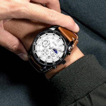 SKMEI Men's Leather Strap Watch with Moonphase and Calendar Features on wrist, white dial, brown leather strap