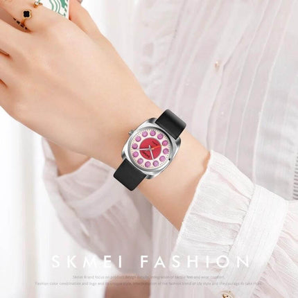 SKMEI Ladies Watch with Leather Strap and Pattern Dial for Daily Wear on wrist, black leather strap and pink patterned dial