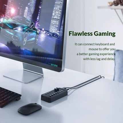 Orico 10-Port USB Hub for Connecting Multiple Devices with Individual Switches on desk next to monitor keyboard and mouse