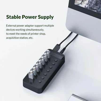 Orico 10-Port USB Hub for Connecting Multiple Devices with Individual Switches shown on desk with cables and individual port switches