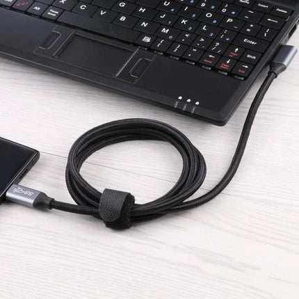 Type-C Elbow Cable for Daily Device Connections at Home - black braided elbow cable connecting laptop and phone, reduces cable strain