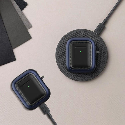 Protective Case with Carabiner for Everyday AirPods Carry showing navy case on wireless charger and clipped cable for commuting convenience