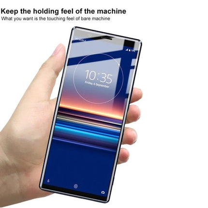 IMAK Curved Hydrogel Screen Protector For Smartphones held in hand showcasing edge-to-edge clarity and touch sensitivity