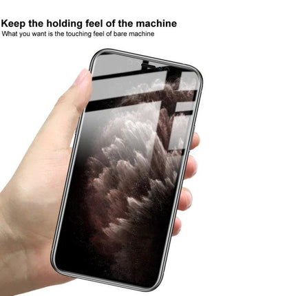IMAK Curved Hydrogel Screen Protector For Smartphones on hand showing edge-to-edge clarity and touch feel