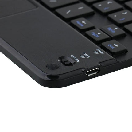 Detachable Bluetooth Keyboard Leather Case for iPad mini 6 with Touchpad — close-up of black keyboard corner showing power switch, caps LED, and micro USB port
