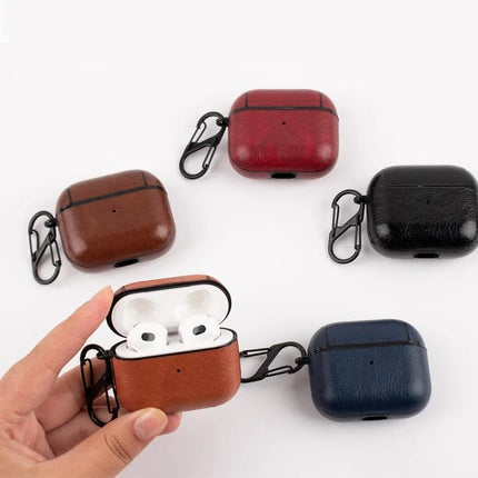 Protective Leather Case for Everyday Earphone Protection - brown, red, black, navy leather earbud cases with carabiner; open case showing white earbuds