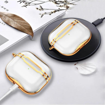 Keep Your AirPods Safe with This Hook Case for Daily Use - white glossy case with gold trim on wireless charger and cable