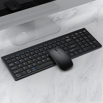 Versatile Three-Mode Wireless Bluetooth Keyboard and Mouse Set for Daily Use on a marble desk showing slim black keyboard and matching mouse for multitasking
