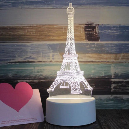 Decorative 3D LED Night Light for Home and Bedroom Settings - Eiffel Tower design glowing on bedside table, soft white ambient light