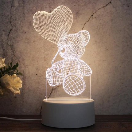 Decorative 3D LED Night Light for Home and Bedroom Settings showing teddy bear holding heart balloon on bedside table