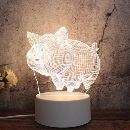 Decorative 3D LED Night Light for Home and Bedroom Settings showing a glowing pig-shaped 3D illusion lamp on a white base