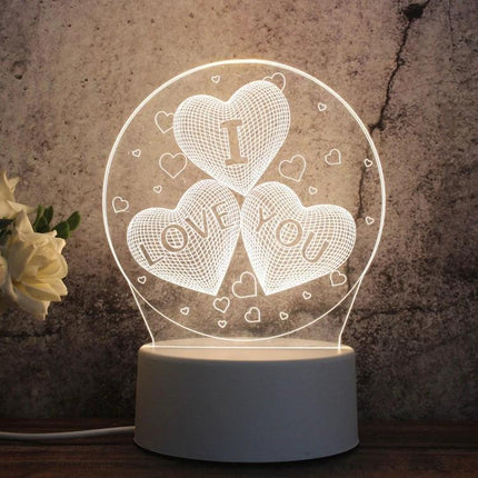 Enhance Your Home Decor With A Fun LED Night Light: heart-themed 3D illusion lamp glowing on bedside table