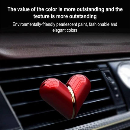 Deformable Car Air Outlet Fragrance Ornament Heart Shaped Aromatherapy red pearl-coated heart on car air vent releasing fragrance