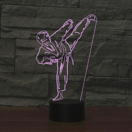 Decorative 3D LED Light for Bedroom and Living Room Use showing a pink acrylic martial artist silhouette on a black battery-powered base