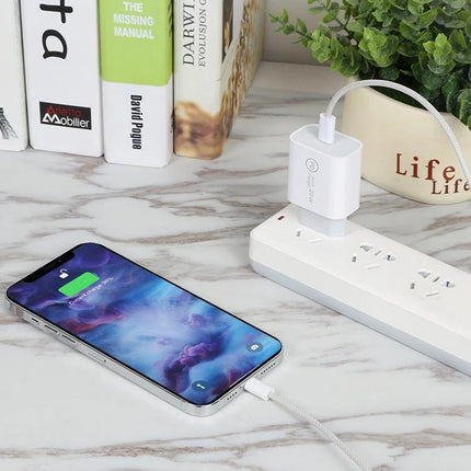 Compact Travel Charger Set for On-the-Go Device Power Needs — white PD fast charger powering phone on marble desk