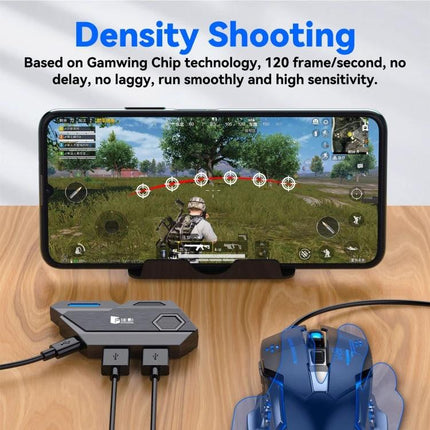 GAMWING Converter for Mobile Gaming with Keyboard and Mouse connected to phone showing FPS shooter gameplay and wired gaming mouse on desk