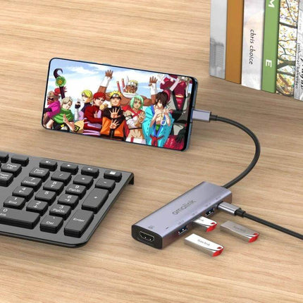 Amalink USB-C Hub for HDMI Connectivity and USB Ports Expansion shown connecting a smartphone to an external display and multiple USB drives