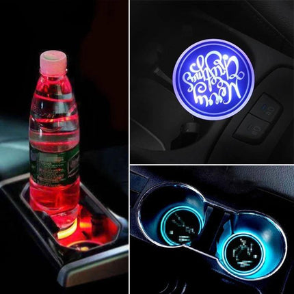 Car Acrylic USB Charger With Multicolor LED Ambience placed in car cup holder showing red, blue and multicolor ambient glow and laser-engraved icons